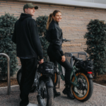 Clemson University student riding a commuter e-bike on campus to class, showcasing an efficient alternative to campus parking.