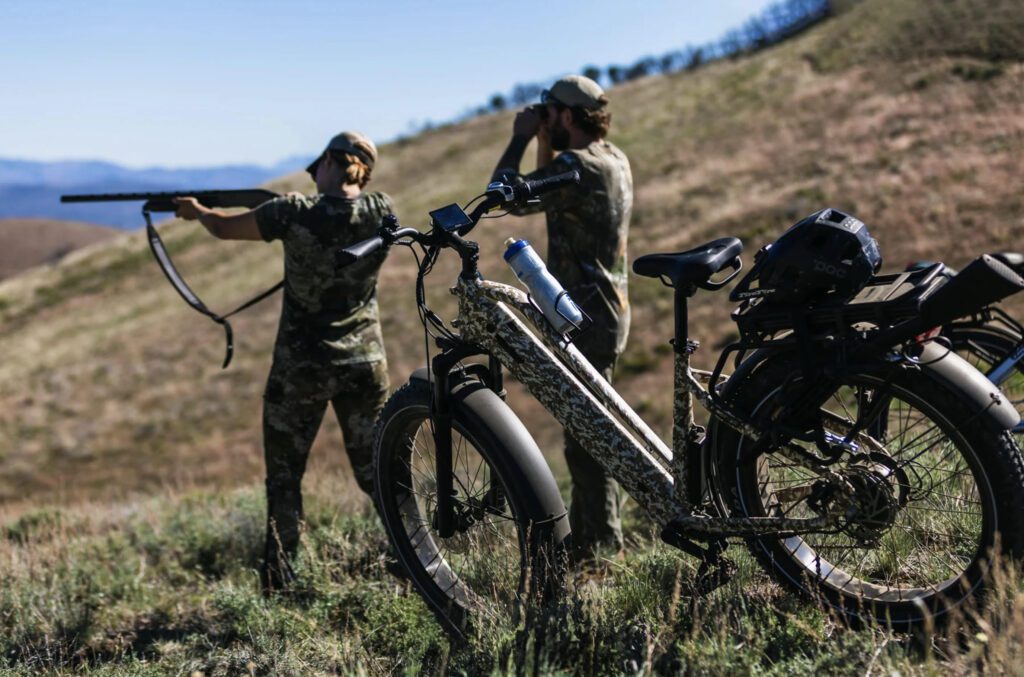 Dirwin Pioneer Plus fat tire hunting ebike parked in field, dual battery, used for silent backcountry access.